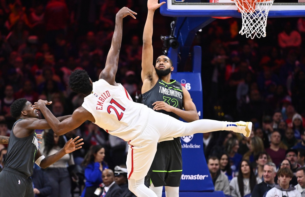 Nov 19, 2022; Philadelphia, Pennsylvania, USA; Philadelphia 76ers center Joel Embiid (21) shoots against Minnesota Timberwolves center Karl-Anthony Towns (32) in the second quarter at Wells Fargo Center. 